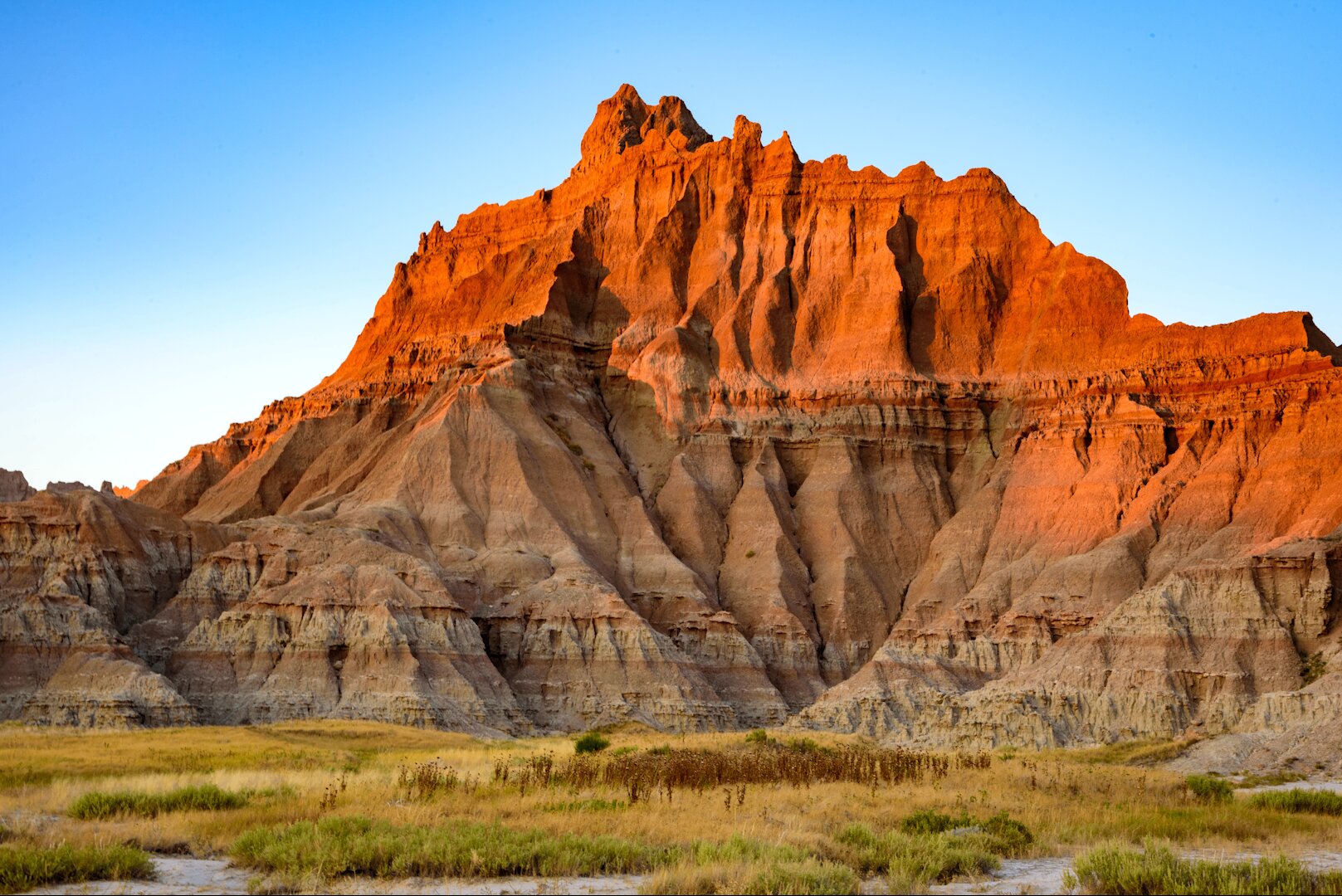 Glowing red rock formation in the Badlands at sunrise — placeholder for a Northern Plains Tribal LWCF story in development.